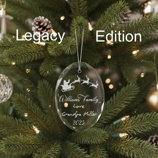 Crystal Christmas ornament with Santa and reindeer sleigh design, engraved lettering , engraved handwritten note, and engraved year, on a green background, labeled 'Legacy Edition.