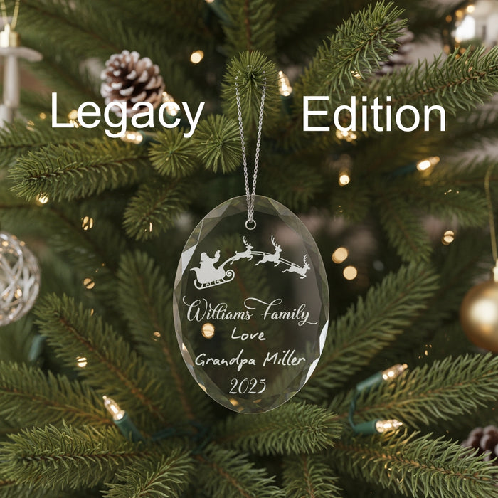 Crystal Christmas ornament with Santa and reindeer sleigh design, engraved lettering , engraved handwritten note, and engraved year, on a green background, labeled 'Legacy Edition.